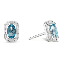 Sterling Silver Oval Swiss Blue Topaz and 0.13ct Diamond Stud Earrings