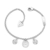 Thumbnail Image 0 of Guess Rhodium Plated Crystal Lotus Charm Bracelet